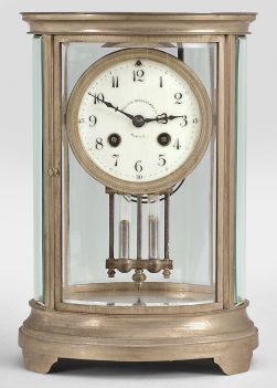 Charles Hour, Paris, for Bigelow, Kennard, & Co., Boston, crystal regulator, 8 day, time and strike, spring driven pendule de Paris movement with Brocot escapement and compensating pendulum in an oval form glazed gilt brass case with cream colored enamel dial with arabic numerals and blued steel hands.