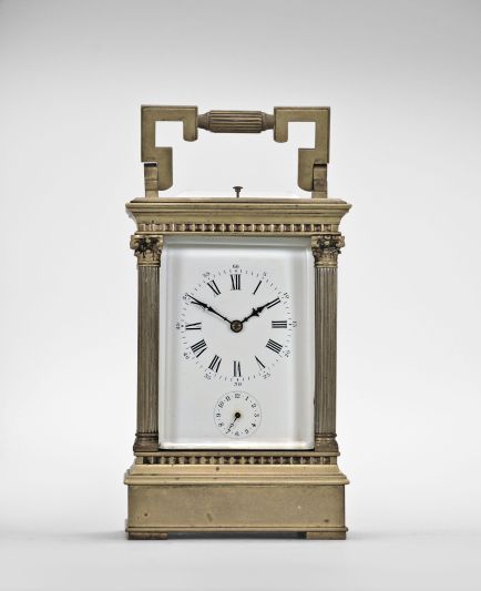 France, carriage clock, 8 day, time and strike with alarm and hour repeat, spring driven movement with lever platform escapement in an Anglaise case with stepped, molded base and cornice, the corners with Corinthian columns, and the top with carrying handle, Roman numeral white enamel dial, and blued steel distaff hands.