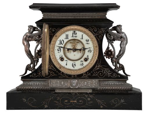 Ansonia Clock Co., New York, "Rosalind" 8 day, time and spring brass movement cast iron black mantel clock with visible escapement. A plaque on the case reads: "Presented by Mr. & Mrs. B. Uberwasser", Sept. 15th, 1906 ".