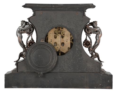 Ansonia Clock Co., New York, "Rosalind" 8 day, time and spring brass movement cast iron black mantel clock with visible escapement. A plaque on the case reads: "Presented by Mr. & Mrs. B. Uberwasser", Sept. 15th, 1906 ".