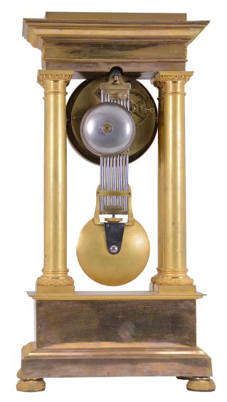 Boileau a Paris, an early 19th century, half seconds beating gilt bronze portico clock, on floral medallion ornamented compressed ball feet, base molding decorated with palmette, anthemion and bellflower, the dado with mount having a central sunflower with mask, and flanking Grecian foliate ornament below the simple molded surbase, four columns with square plinths, laurel wreathed molded bases, and egg and dart capitals supporting the entablature, the frieze with floral medallions and cornice with waterleaf, palmette and bellflower, laurel wreath bezel with simple foliate inner ring, roman numeral white enamel dial with inner seconds chapter,signed "Boileau a Paris", blued steel Breguet style hands and central seconds hand, large two train movement with knife edge suspension and pin wheel escapement, counting the hours on a bell, and heavy bimetallic half seconds beating gridiron pendulum