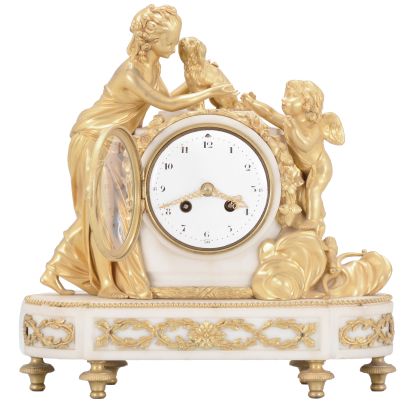 Samuel Marti, Paris, France, figural mantel clock, 8 day, time and strike, spring driven pendule de Paris movement in a white marble case on turned brass feet with applied gilt ornaments, supporting gilt figures of a woman, dog, and Cupid, white convex enamel dial with Arabic numerals and gilt fleur-de-lis hands.