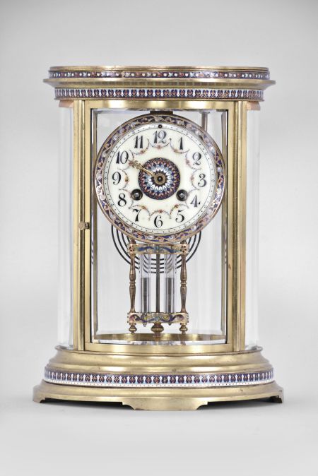 S. Marti & Cie, Paris, France, oval crystal regulator, 8 day, time and strike, spring driven pendule de Paris movement in a gilt brass case with four curved beveled glasses, cloisonné trim in bands around the case top and bottom, dial, and on the frame of the compensating pendulum, cream colored enamel dial with Arabic numerals, gilt hands, and double-vial pendulum.