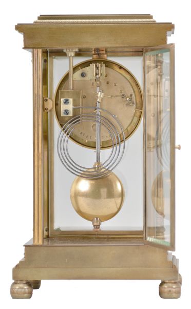 Vincenti & Cie, Paris, France, crystal regulator, 8 day, time and strike, spring driven pendule de Paris movement in a glazed brass case on cast bun feet supporting fluted columns on the front corners and pilasters on the back corners, stepped and molded base and top with repeating palmette and laurel fretwork, matching pendulum, Roman numeral white enamel dial with red Arabic numerals at the quarters, and blued steel Breguet style hands.