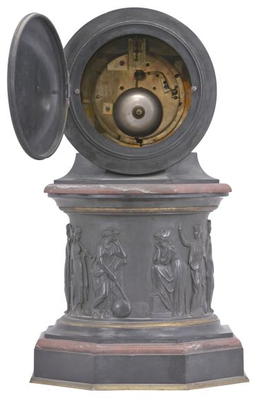 E. Maurice & Co., Paris, France, for Shreve, Crump & Low, Boston, mantel clock, 8 day, time and strike, spring driven pendule de Paris movement with visible Brocot escapement on an molded octagonal base with gilt brass and red marble ovolo molding supporting a central column with the Greek muses cast with relief from patinated metal, supporting a molded octagonal capital upon which rests a drum head of black slate holding the movement, bezel, and polished black slate dial with incised Roman numerals and gilt hands.