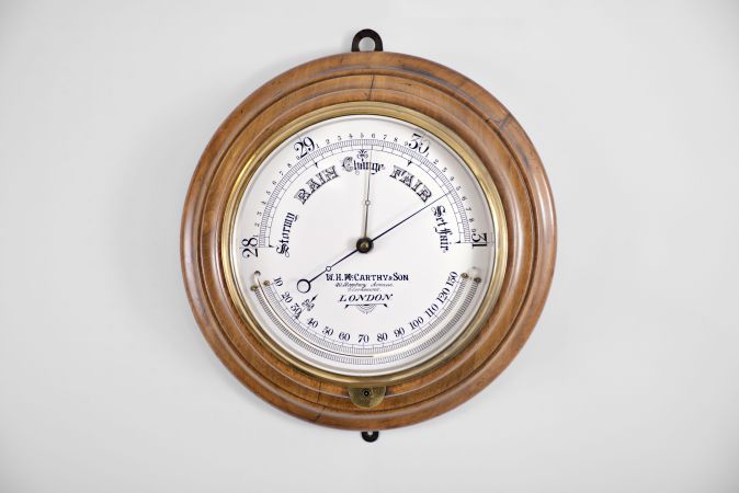 W. H. McCarthy & Son, London, large aneroid barometer and thermometer.