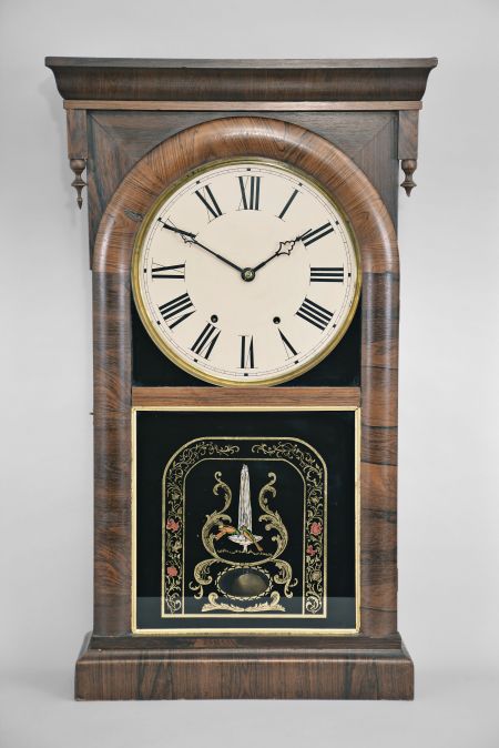 Ansonia Brass and Copper Co., Ansonia, Conn, shelf clock with a weight driven 8 day time and strike movement in a rosewood veneered case.