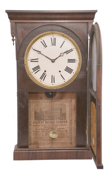 Ansonia Brass and Copper Co., Ansonia, Conn, shelf clock with a weight driven 8 day time and strike movement in a rosewood veneered case.