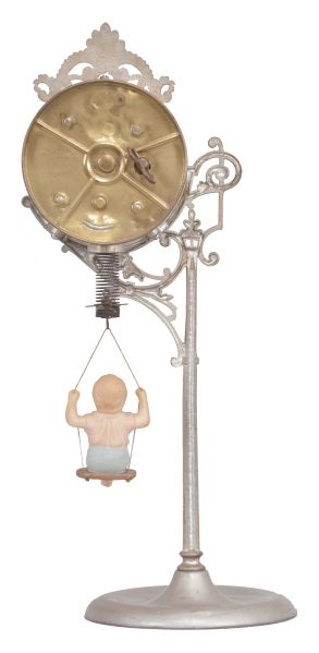 Ansonia Clock Co., New York, "Jumper No. 1" bobbing doll shelf clock with a spring driven one day timepiece movement in a nickel plated case.