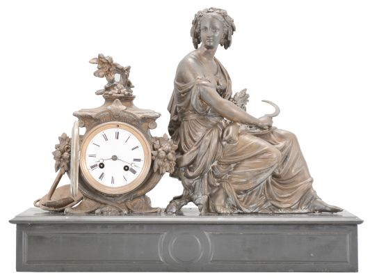 Japy Frères & Cie, Paris, France, figural mantel clock, 8 day, time and strike, spring driven pendule de Paris movement, black slate base with molded front and top supporting a cast spelter case with agrarian theme including a basket and hoe, and seated female figure with a sickle in one hand and a sheaf of wheat in the other, white enamel dial with Roman numerals, and blued steel Breguet hands.