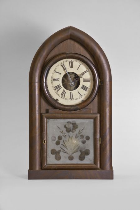 Brewster & Ingrahams, Bristol, Conn., 8 day, time and strike spring brass movement round gothic or beehive shelf clock with rack and snail strike and case iron spring barrels.