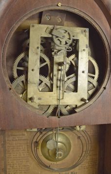 Brewster & Ingrahams, Bristol, Conn., 8 day, time and strike spring brass movement round gothic or beehive shelf clock with rack and snail strike and case iron spring barrels.