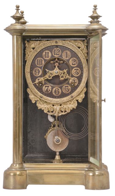 Ansonia Clock Co., New York, "Symbol Extra", 8 day, time and strike spring brass movement crystal regulator shelf clock with black and gilt hard rubber dial.