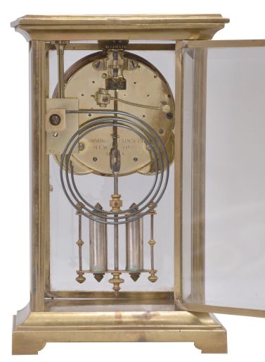 Clocks- 2 (Two): (1) Waterbury Clock Co., Waterbury, Conn. unidentified cornice top shelf clock with a spring driven 8 day time and strike movement in a rosewood veneered case. c1865; (2) Ansonia Clock Co., New York., "Dolphin" crystal regulator with a spring driven 8 day time and half hour strike movement in a polished brass and beveled glass case. c1914.