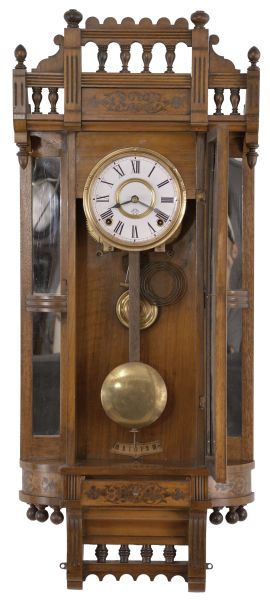 Ansonia Clock Co., New York, "Reflector" wall hanging clock with a spring driven 8 day time and strike (cathedral gong) movement in a walnut case.