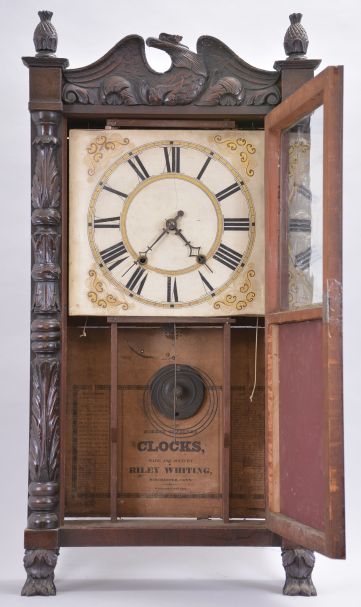 Riley Whiting, Winchester, Conn., 30 hour, time and strike weight wood movement carved column and eagle splat shelf clock.