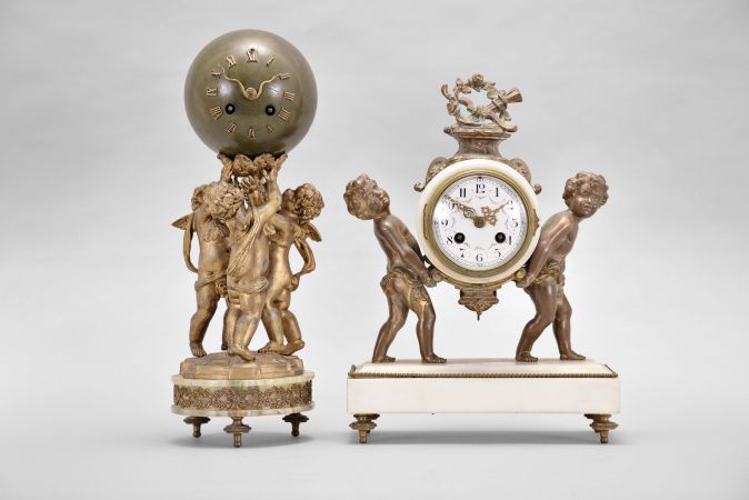 Clocks- 2 (Two) French mantel: (1) Samuel Marti, Paris, for A. Thelot, figural mantel clock, 8 day, time and strike, spring driven pendule de Paris movement, white marble case on brass feet with two cast child figures supporting a white marble case between them, white enamel dial with polychrome garlands and Arabic numerals, gilt hands, c1900; (2) France, figural mantel clock, 8 day, time and strike, spring driven pendule de Paris movement, green onyx base on cast brass feet, supporting three putti holding a green patinated sphere and the mechanism within aloft, applied Roman numerals and gilt snake-form hands, c1915.