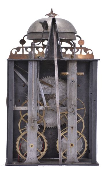 France, Comtoise clock, 8 day, time and strike, weight driven movement, verge escapement, thread suspension with rear-hanging pendulum in an iron post and plate frame, cast brass dial with royal symbols including a crown resting on the earth and profile of a young Louis XV or his son The Dauphin, white enamel cartouches with blue Roman numerals, single iron hand, four flat brass spandrels, topped by pierced flat brass fronton, mid 18th Century.