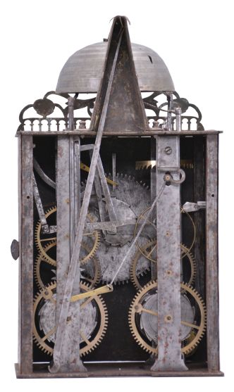 France, Comtoise clock, 8 day, time and strike with alarm, weight driven movement with verge escapement, thread suspension with rear-hanging pendulum in a iron post and plate frame, brass chapter ring with engraved Roman numerals, alarm dial with Arabic numerals, single brass hand, applied brass spandrels and pivoted winding arbor shutters, topped by flat pierced brass fronton with trademark.