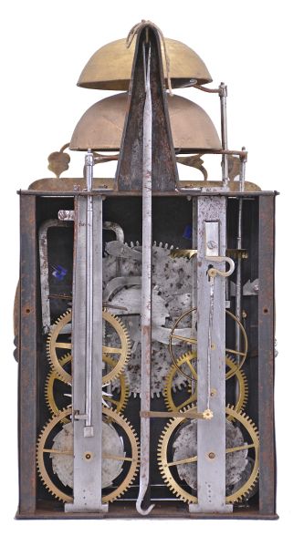 France, Comtoise clock, 8 day, time and strike with alarm, weight driven movement with verge escapement, thread suspension with rear-hanging pendulum in an iron post and plate frame, cast brass dial signed "P I M" with inset white enamel cartouches with blue Roman numerals, alarm ring with Arabic numerals, single iron hand, topped by a pierced brass fronton.