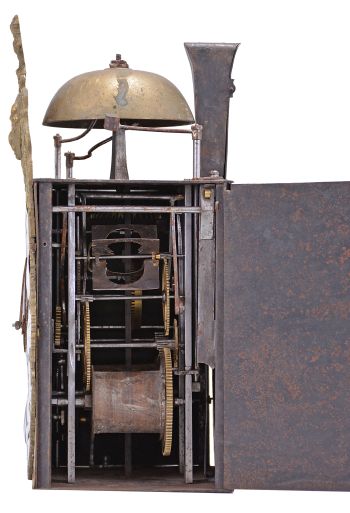 France, bronze-front Comtoise clock, 8 day, time and strike with alarm, weight driven movement, verge escapement with thread suspension and rear-hanging pendulum in an iron post and plate frame, cast brass dial with inset white enamel cartouches with blue Roman numerals for the hours and black Arabic numerals for the minutes, brass alarm ring with Arabic numerals, two pierced steel hands, applied brass spandrels below the dial, and topped with a cast fronton featuring a forward facing Gallic rooster over a medallion with three fleur de lis.