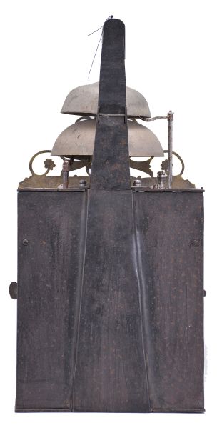 France, Comtoise clock, 8 day, time and strike with two bells, weight driven movement, verge escapement, thread suspension with rear-hanging pendulum in an iron post and plate frame, cast brass dial with two iron hands, floral motif and inset with 24 white enamel cartouche numerals, blue Roman numerals for the hours and black Arabic numerals every five minutes, flat brass winding arbor shutters below the dial, and pierced brass fronton.