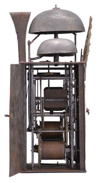 France, bronze-front Comtoise clock, 8 day, time and quarter strike with alarm, three bells, weight driven movement with verge escapement, thread suspension with rear-hanging pendulum in an iron post and plate frame, cast brass dial inset with 12 white enamel cartouches showing Roman numerals, Arabic numerals at 5 minute intervals on the outer rim, brass alarm ring with Arabic numerals, two iron hands, pivoted brass winding arbor shutters engraved with "A" and "M", all topped by cast fronton depicting trumpeters flanking a small forward facing Gallic rooster.