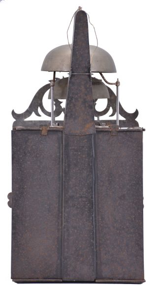 France, Comtoise clock, 8 day, time and strike with alarm, weight driven movement with verge escapement, thread suspension with rear-hanging pendulum in a iron post and plate frame, pewter chapter ring with engraved Roman numerals, brass alarm ring with Arabic numerals, pivoted brass winding arbor shutters with engraving, pierced brass fronton with engraving, and single brass fleur de lis hand.