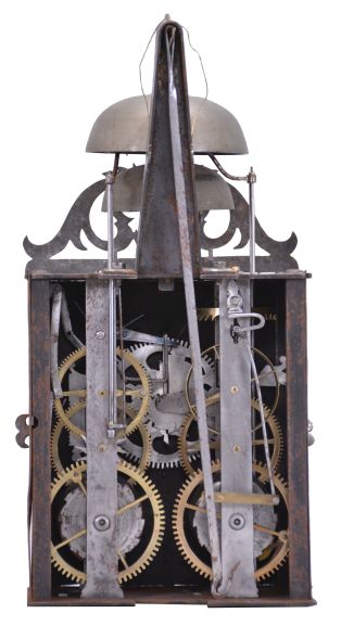 France, Comtoise clock, 8 day, time and strike with alarm, weight driven movement with verge escapement, thread suspension with rear-hanging pendulum in a iron post and plate frame, pewter chapter ring with engraved Roman numerals, brass alarm ring with Arabic numerals, pivoted brass winding arbor shutters with engraving, pierced brass fronton with engraving, and single brass fleur de lis hand.