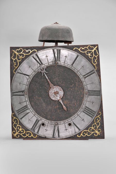 France, oversize Comtoise clock, 8 day, time and strike, weight driven movement with verge escapement, thread suspension with rear-hanging pendulum in an iron post and plate frame, 14 inch pewter chapter ring with Roman numerals, pierced brass spandrels, single iron hand in the form of a fleur de lis.