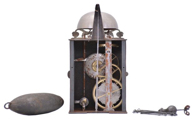 J. Mayet, Morbier, France, Comtoise clock, 8 day, time and alarm, weight driven movement with verge escapement, thread suspension with rear-hanging pendulum in a iron post and plate frame, brass chapter ring with engraved Roman numerals, brass alarm ring with engraved Arabic numerals, pierced brass spandrels and engraved plaque below the dial reading "J. Mayet a Morbier", single brass hand, all topped with a pierced brass fronton.